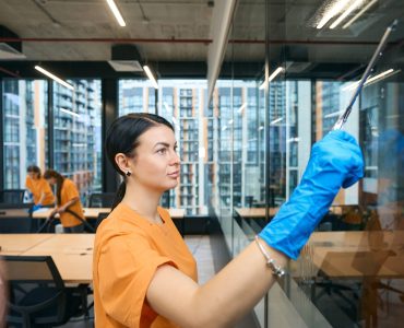 Qualified employees of the cleaning company clean and disinfect all surfaces in the coworking space