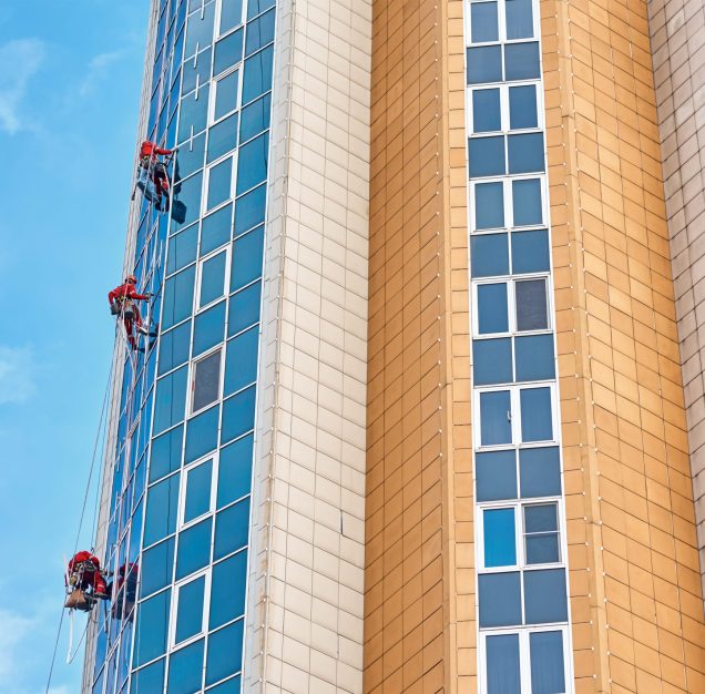 Group of industrial climber work on modern building outdoor